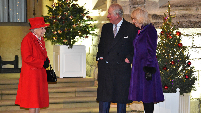 Queen Elizabeth Prince Charles and Camilla laughing at Christmas