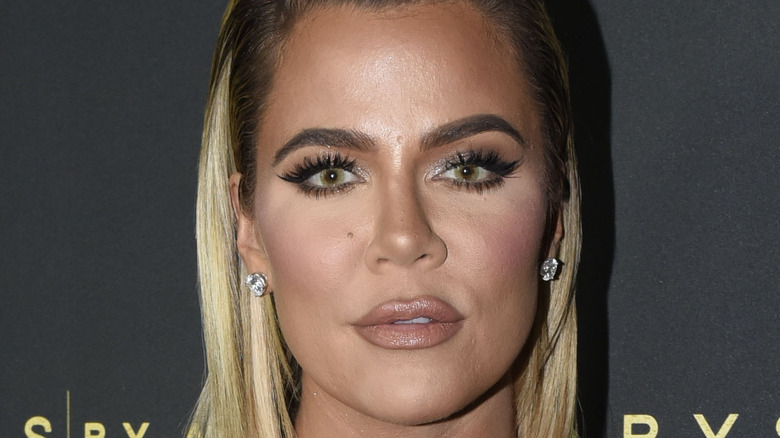 Khloe Kardashian wearing earrings