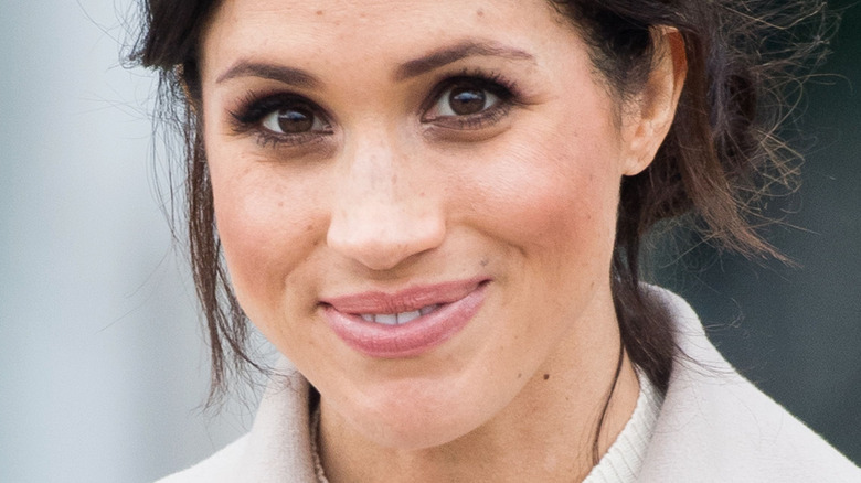 Meghan Markle smiling at camera