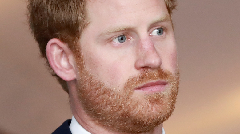 Prince Harry with a neutral expression