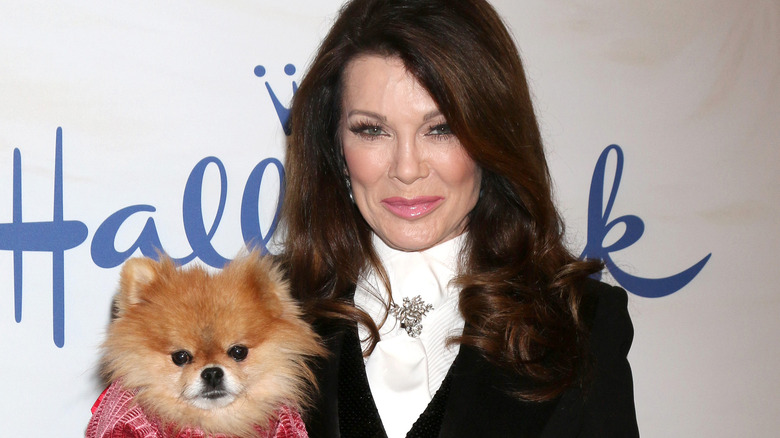 Lisa Vanderpump walking red carpet with her dog