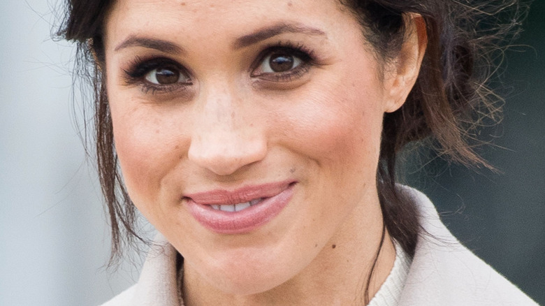 Meghan Markle smiling for photo