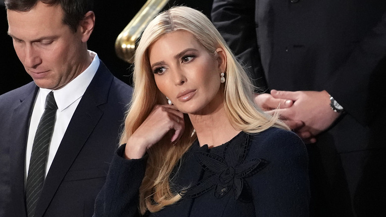 Ivanka Trump adjusting her hair at the Capitol.