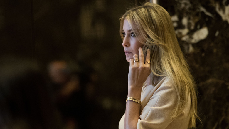 Ivanka Trump on the phone, wearing jewelry