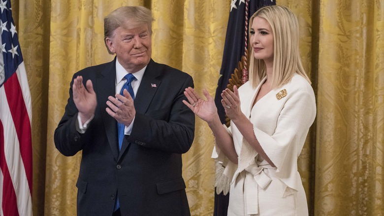Donald and Ivanka Trump clapping
