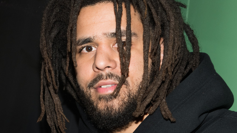 J. Cole smiling