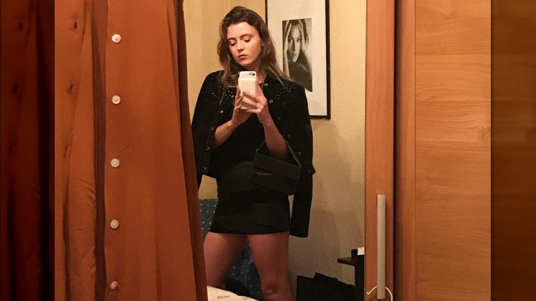 Lorraine Nicholson taking a selfie of her all-black outfit.