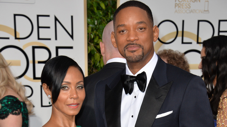 Jada Pinkett Smith and Will Smith, wearing formal wear 