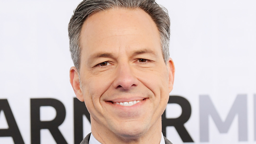 Jake Tapper smiles on a 2019 red carpet