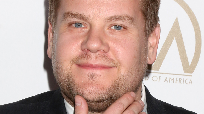 James Corden hand to face