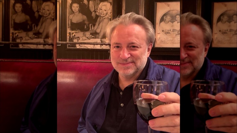 Keith McNally raising a toast