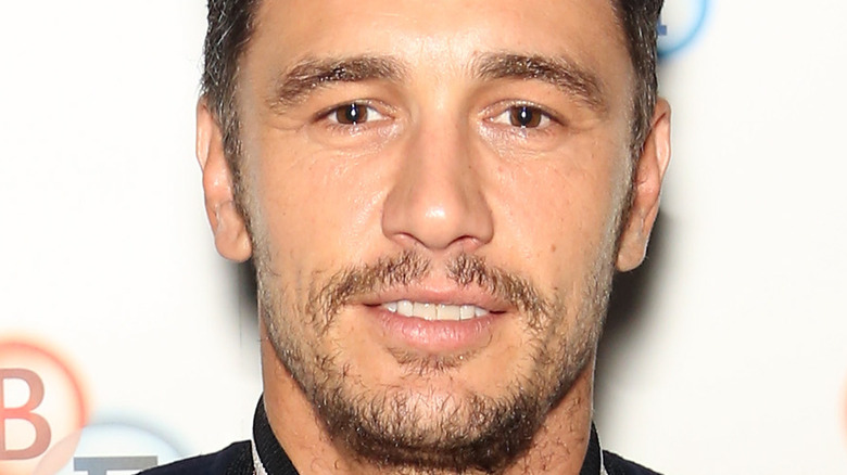 James Franco giving a small relaxed smile