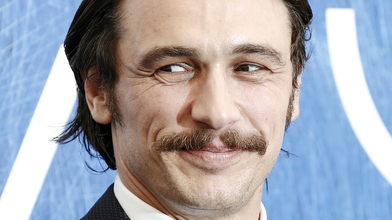 James Franco smiles on the red carpet