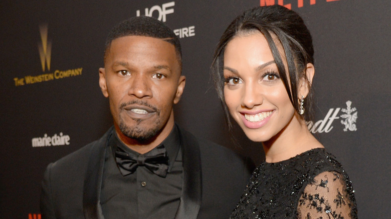 Jamie and Corinne Foxx smiling