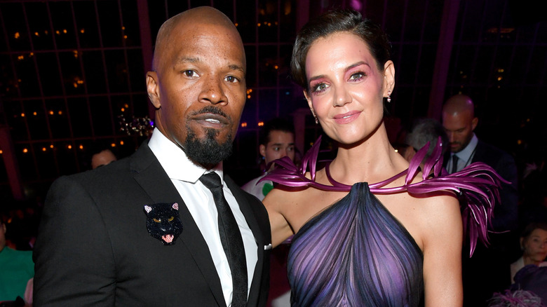 Jamie Foxx posing with Katie Holmes