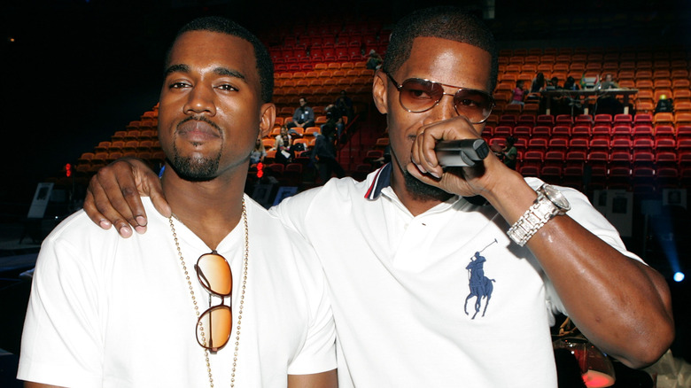 Jamie Foxx with arm around Kanye West