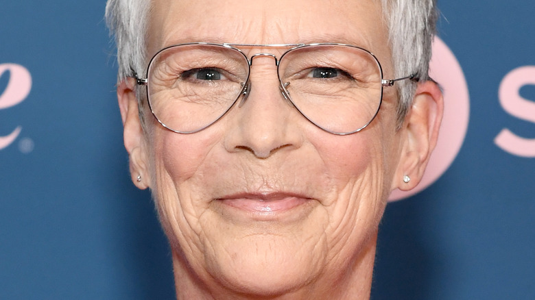 Jamie Lee Curtis smiling for photo with glasses