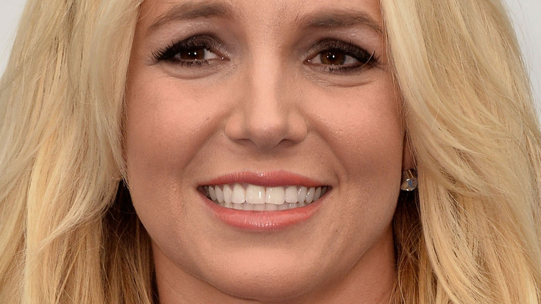 Britney Spears smiles with blonde hair