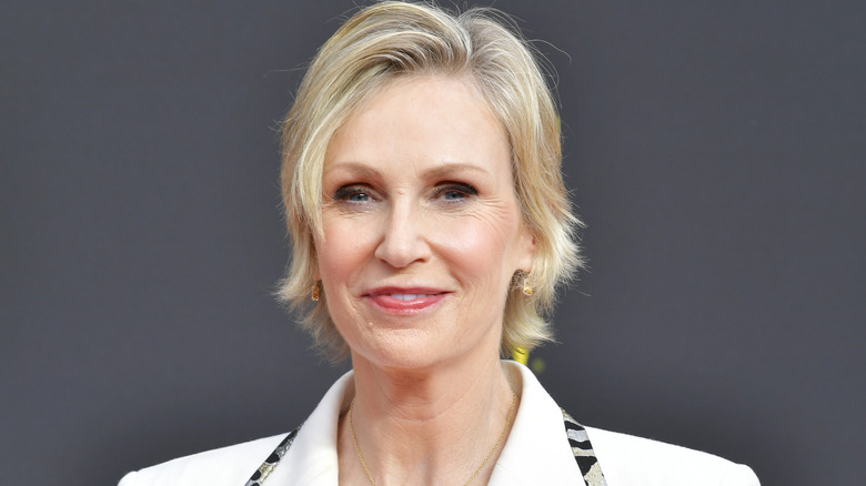 Jane Lynch poses against grey background