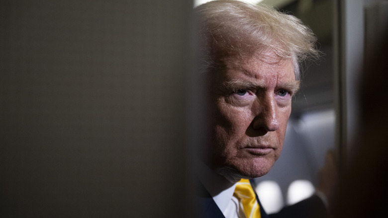 Donald Trump speaking to the press on Air Force One.