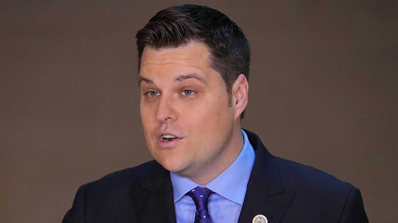 Matt Gaetz speaking at a podium.