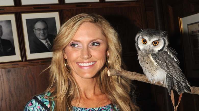 Lara Trump smiling next to an owl