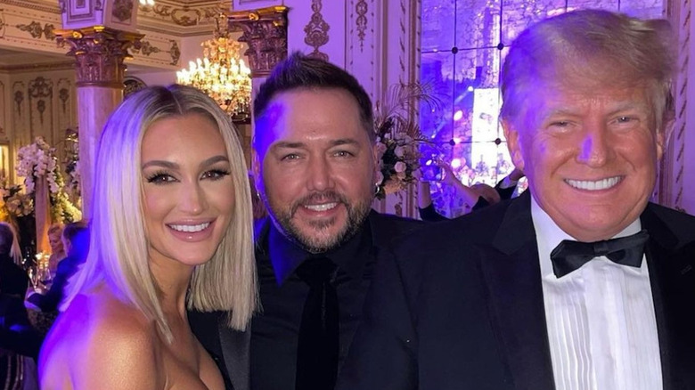 Jason Aldean, Brittany Aldean, and Donald Trump smiling