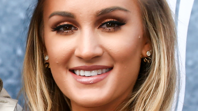 Brittany Aldean smiles for a photo