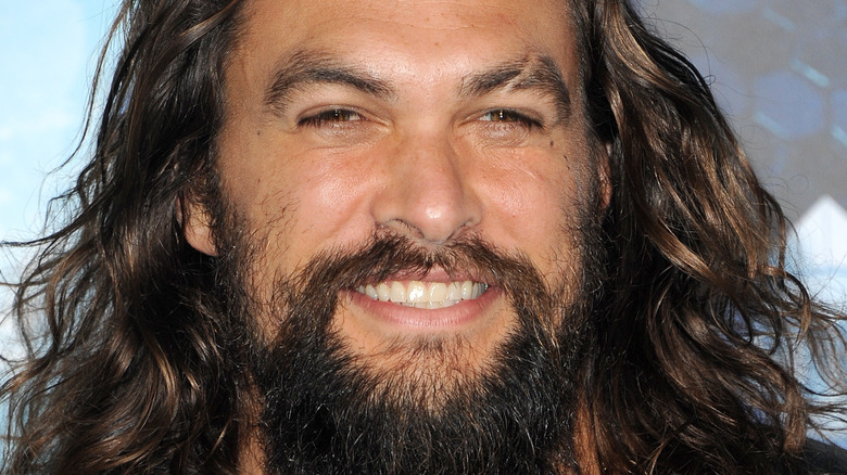 Jason Momoa smiles in 2018