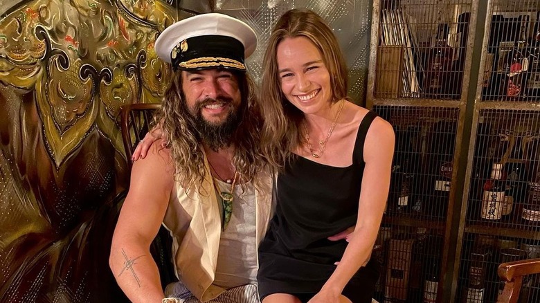 Jason Momoa and Emilia Clarke smiling
