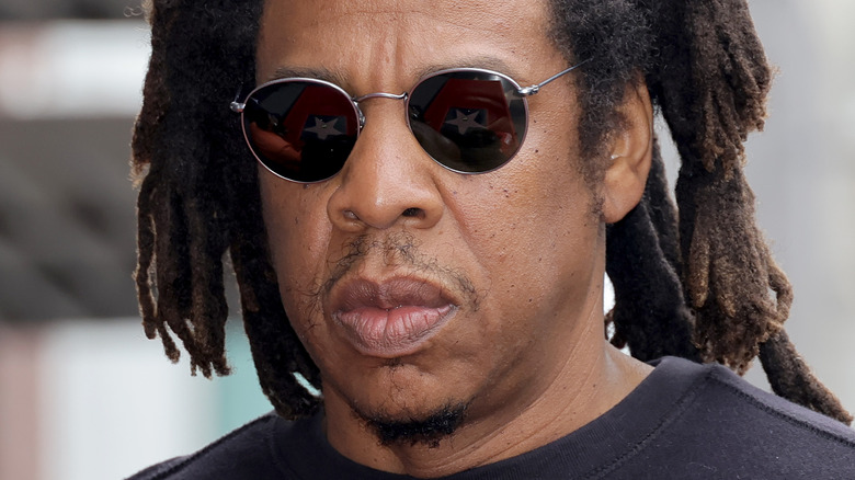 Jay Z wearing dark sunglasses