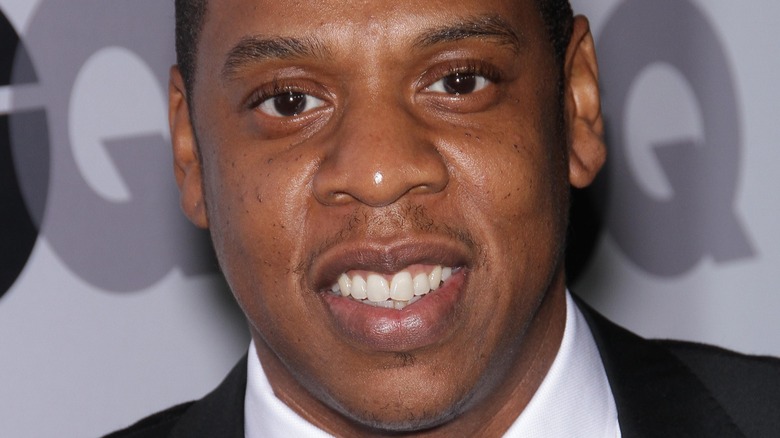 Jay-Z smiling on the red carpet