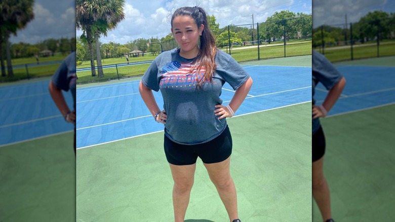 Jazz Jennings posing on tennis court