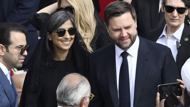 JD Vance and Usha Vance posing for a picture at the inauguration mass of Pope Leo XIV