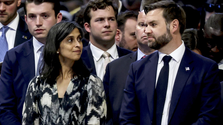 Usha Vance and JD Vance standing and making eye contact