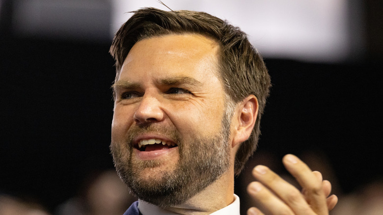 JD Vance smiling while clapping.