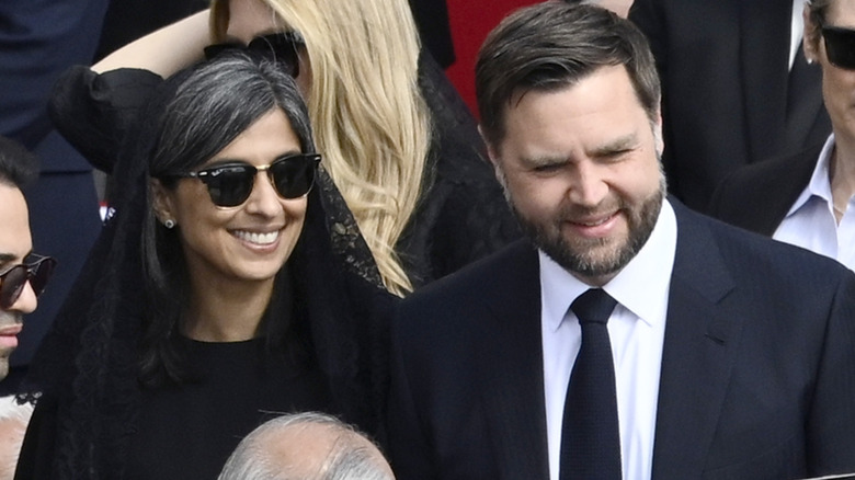 Usha Vance and JD Vance in crowd wearing formal clothing