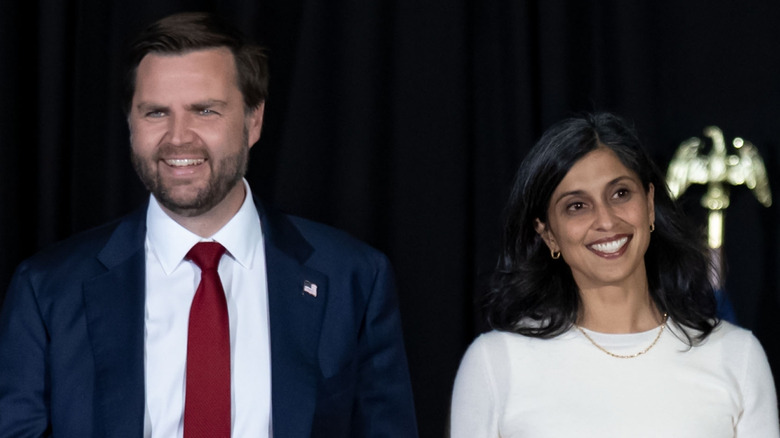 JD Vance and Usha Vance walk hand in hand