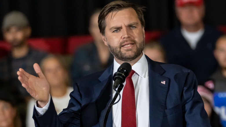 JD Vance at a microphone delivering a speech