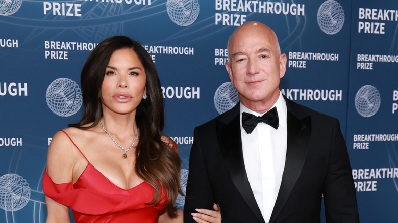 Lauren Sanchez and Jeff Bezos at the 2025 Breakthrough Prize ceremony, looking into the camera straight-faced with some distance between them