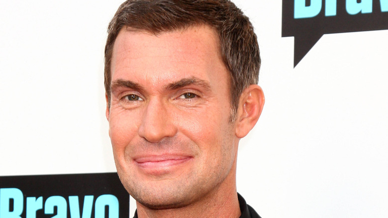 Jeff Lewis smirks