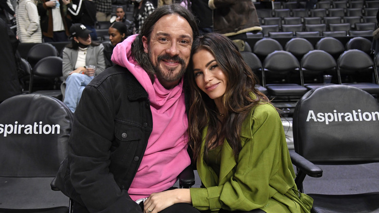 Steve Kazee and Jenna Dewan hugging at an event
