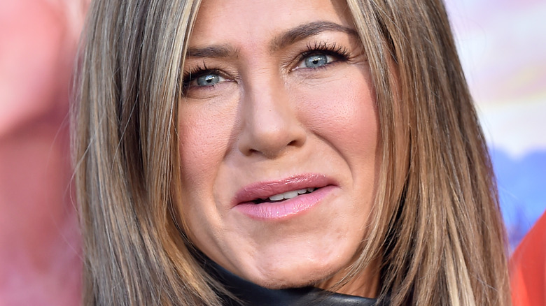 Jennifer Aniston slightly smiling blue eyes 