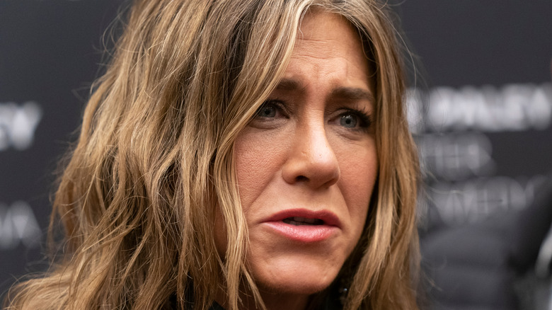 Jennifer Aniston looking sad frowning