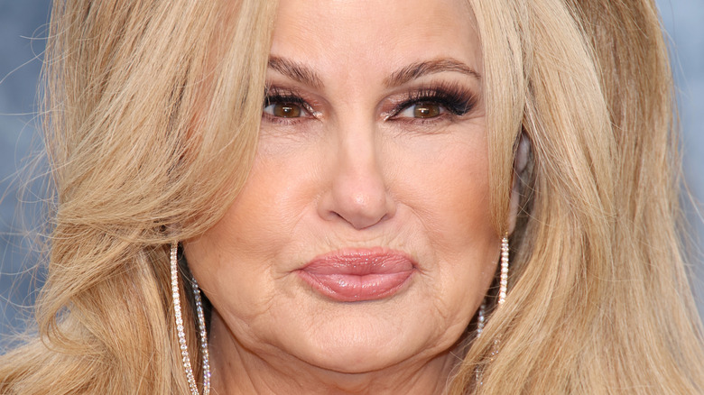 Jennifer Coolidge with lips pressed together