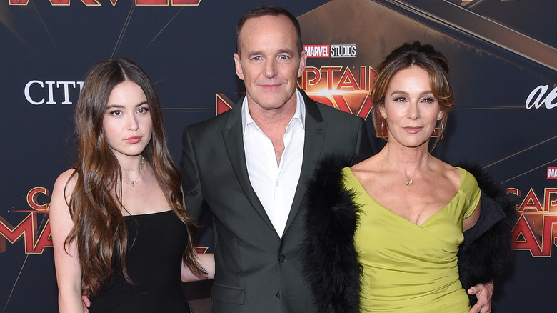 Stella Gregg, Clark Gregg, and Jennifer Grey posing