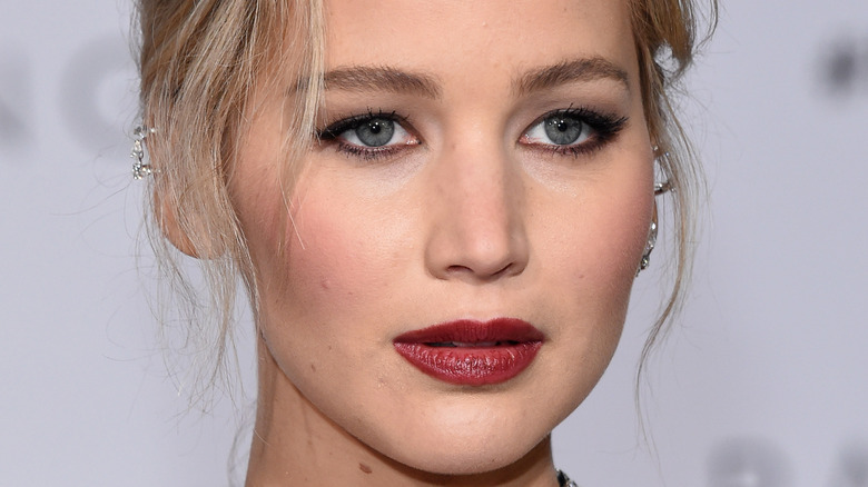 Jennifer Lawrence poses in red lipstick