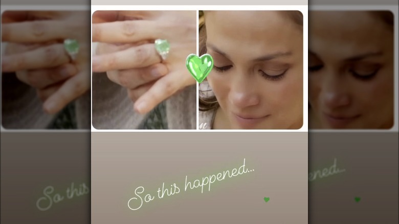 Jennifer Lopez looking down at her green engagement ring