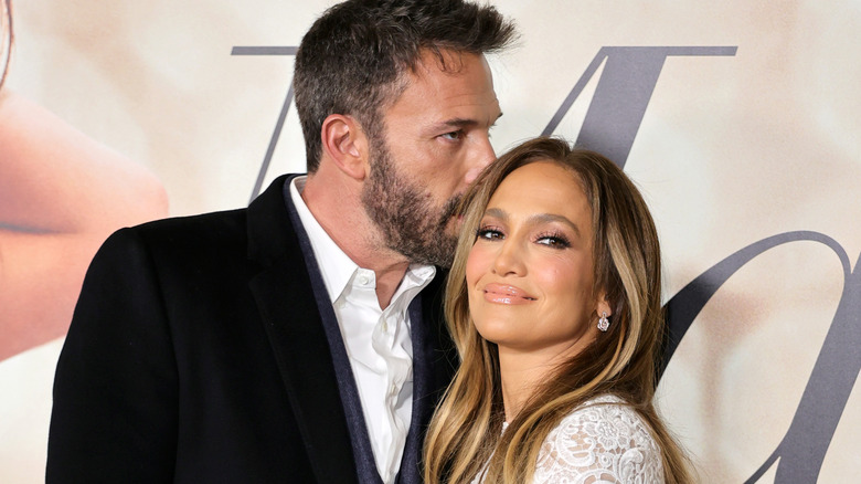 Ben Affleck kisses smiling Jennifer Lopez on red carpet 2022