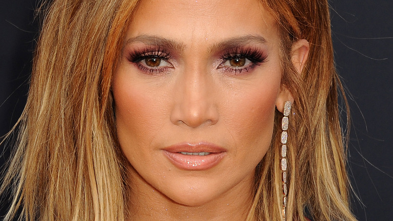 Jennifer Lopez with serious expression on red carpet